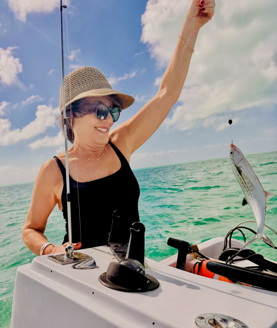 Flats fishing off Ambergris Caye: a guest with her catch