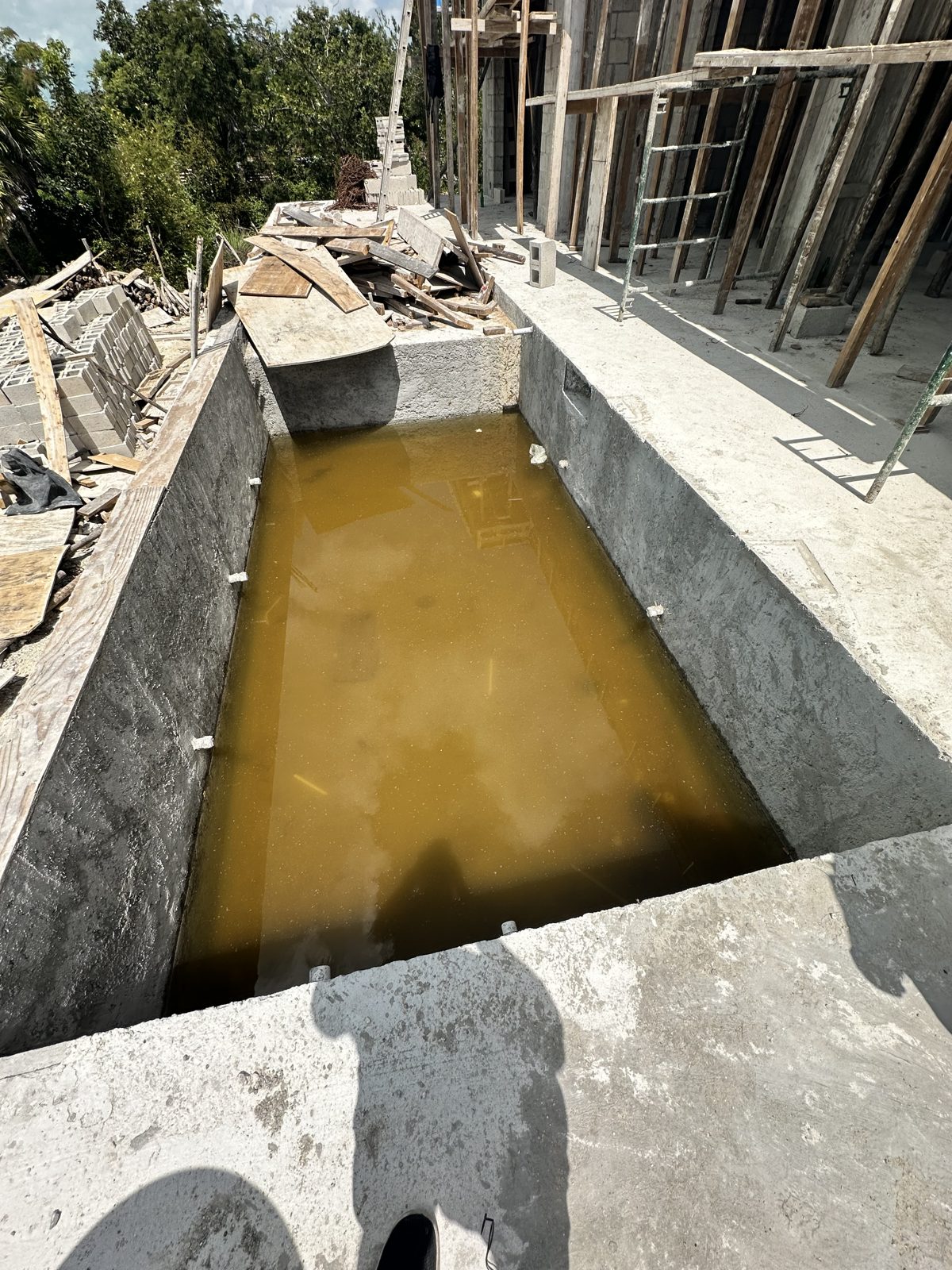 The poured concrete pool shell during construction, before its finish