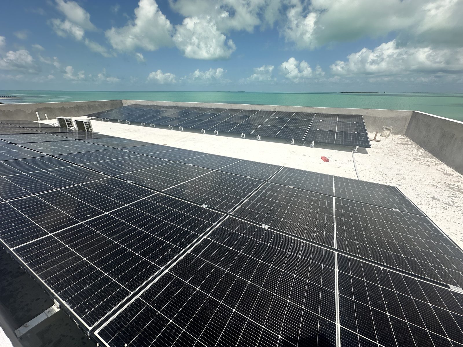 The rooftop solar array installed by Deeds Solar on the villa roof deck