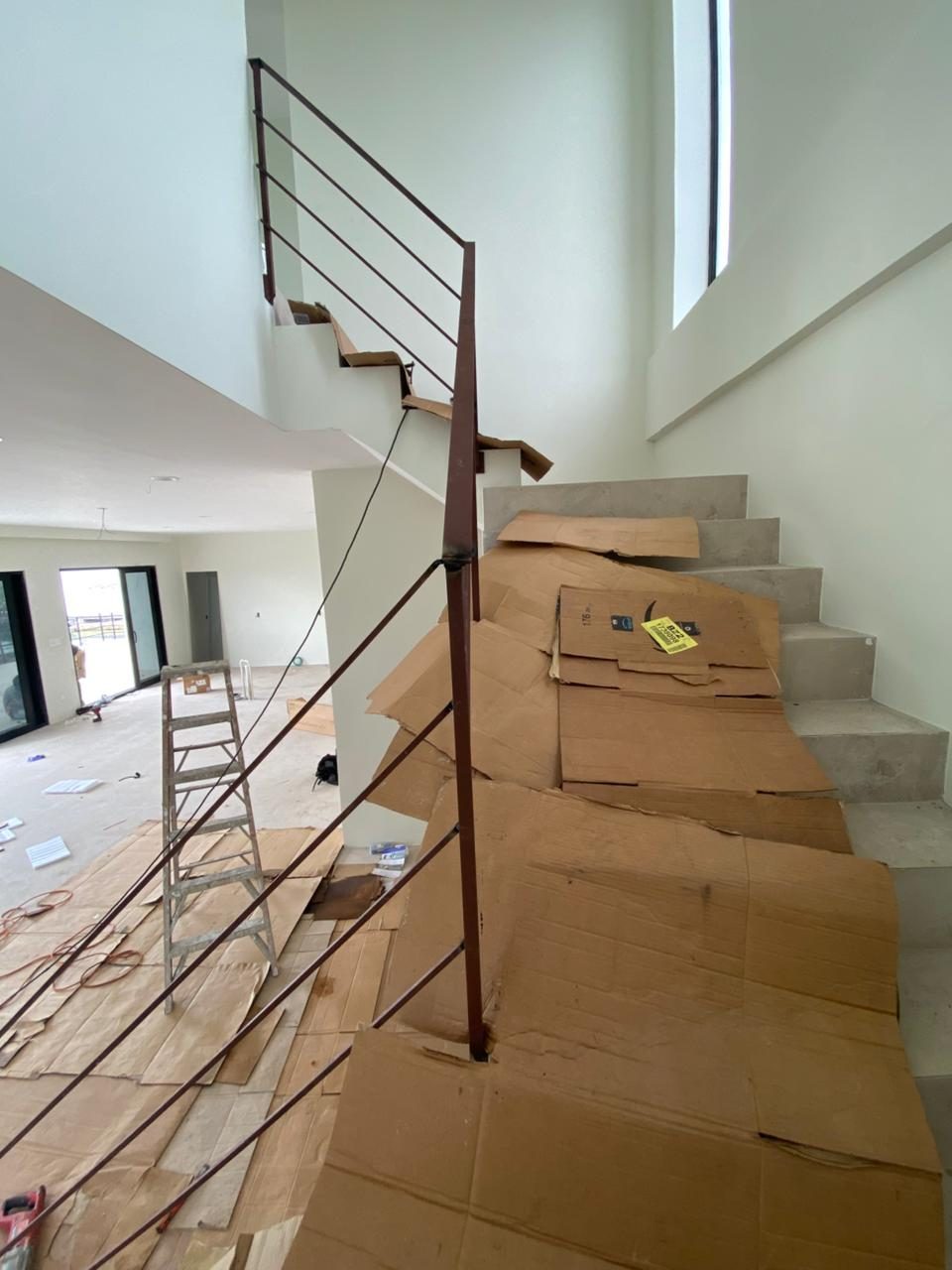 Aluminum stair railing with a mahogany top rail, built by SS&J Builders